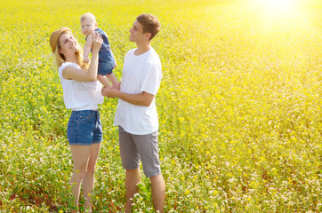 Young happy family with their infant boy