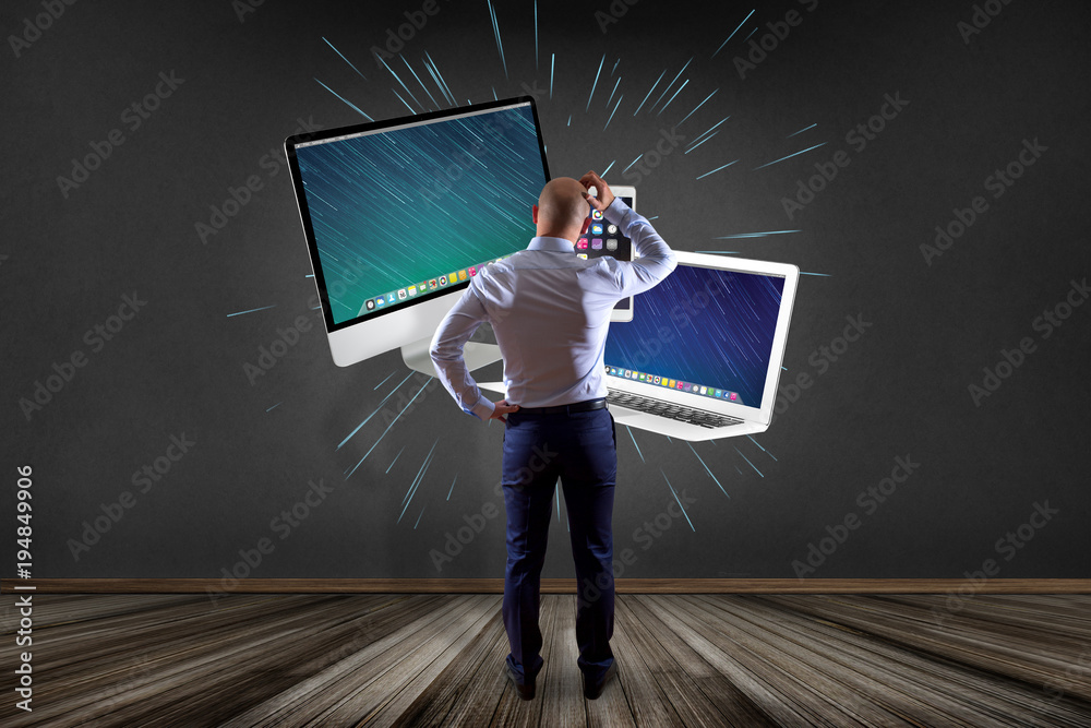 Poster businessman in front of a wall with computer and devices displayed on a futuristic interface - multi