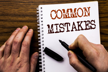 Handwritten text showing word Common Mistakes. Business concept for Common Concept Written on...