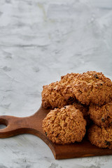 Top view close-up picture of tasty chocolate cookies on the cutting board, shallow depth of field, selective focus
