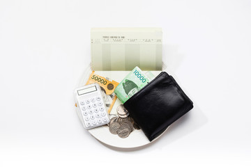 Korean currency on the plate with wallet, coin, cash and bankbook