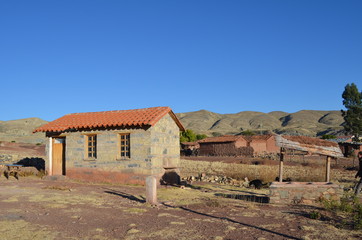 Fototapeta na wymiar Rock Cottage in small village in Crater of volcano Maragua