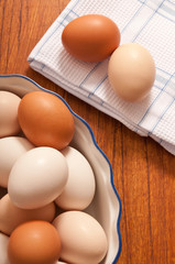 raw hen eggs in vintage bowl like in rustic styl like a concept for organic, classic, farm cooking and Easter 