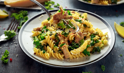 Homemade Pasta fusilli with Chicken, Green Kale, Garlic, lemon and parmesan cheese. healthy home food