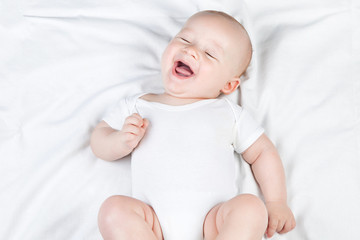 Laughing nursing baby