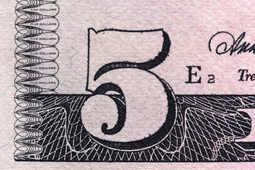 fragment of a banknote five American dollars