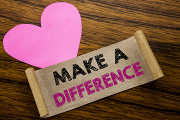 Writing text showing Make A Difference. Business concept for Motivation Success written on sticky note paper, wooden wood background. With pink heart meaning love adoration.