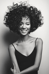 Beautiful woman with afro curls hairstyle