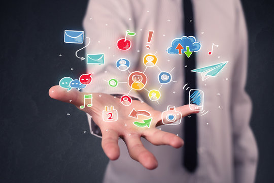 Businessman holding colorful applications