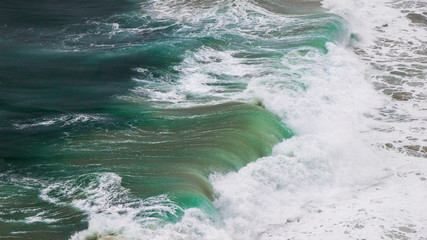 Ocean storm with with big windy waves. Background shot of clear sea water surface