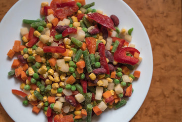 Frozen mexican mix of vegetables assorted on white plate