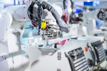 Mechanical hand robot loading automotive part working