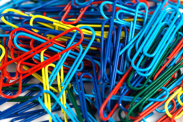 Bunch of colorful paper clips isolated on white background