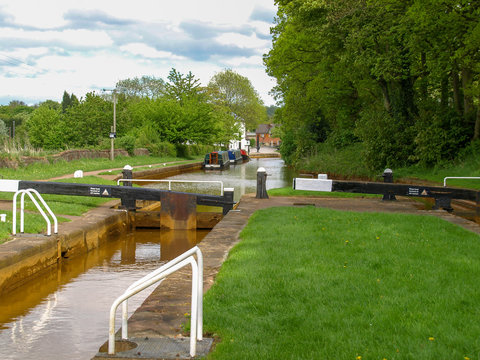 Red Bull Lock - dual lock on the Trent and Mersey canal near Stoke-on-Trent in Staffordshire, England. View from the bridge over the bottom gate.