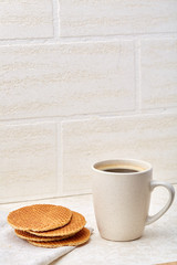 Close-up white cup of coffee with chocolate chip cookies on white background, top view