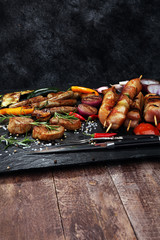 Assorted delicious grilled meat with vegetable on a barbecue