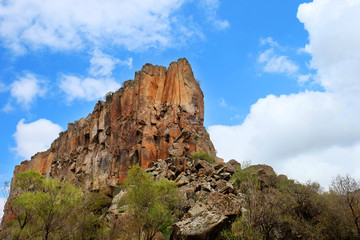 Fototapeta na wymiar Big cliff at Ihlara Valley on cloudy blue sky day