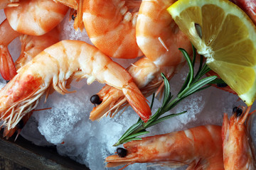 Raw fresh Prawns Langostino Austral. shrimp seafood with lemon and spices.