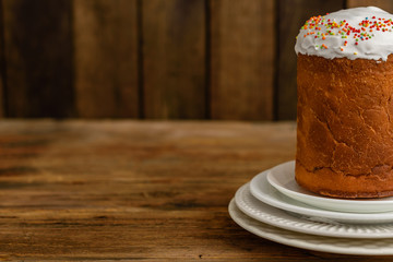 Easter cake on a brown wooden table. It can be used as a background
