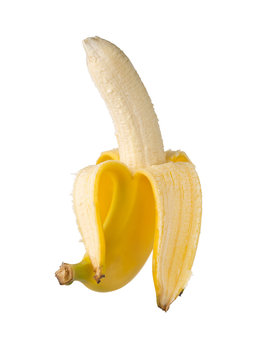 Single fresh, yellow, ripe banana half peeled
