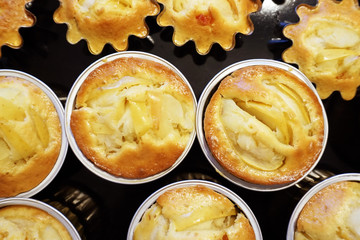 Fresh homemade delicious apple cupcake muffins in forms - sweet food