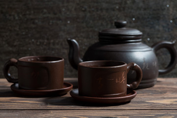 Chinese tea utensils - dark clay teapot and cups