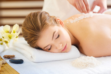 Fototapeta na wymiar Beautiful, young and healthy woman in spa salon. Massage treatment