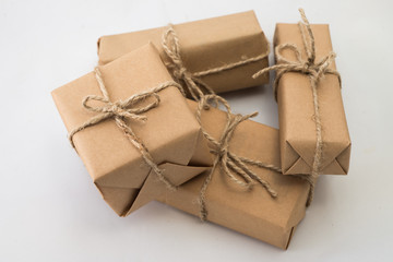 Stack of handcraft gift boxes on white background