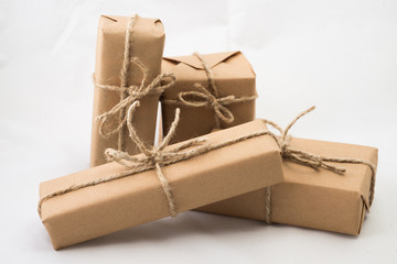 Stack of handcraft gift boxes on white background