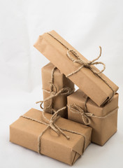 Stack of handcraft gift boxes on white background