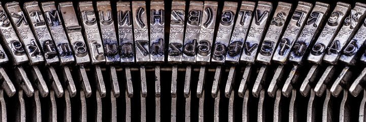 Numbers and letters on an old typewriter machine macro shot