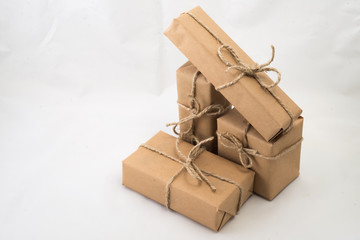 Stack of handcraft gift boxes on white background