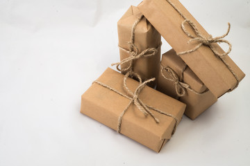 Stack of handcraft gift boxes on white background