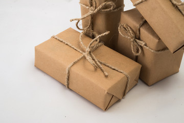 Stack of handcraft gift boxes on white background