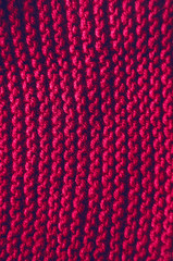 a thread. knitting. texture and background. burgundy