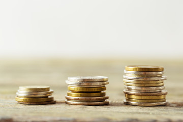 coins stack on wooden table