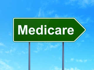 Medicine concept: Medicare on green road highway sign, clear blue sky background, 3D rendering