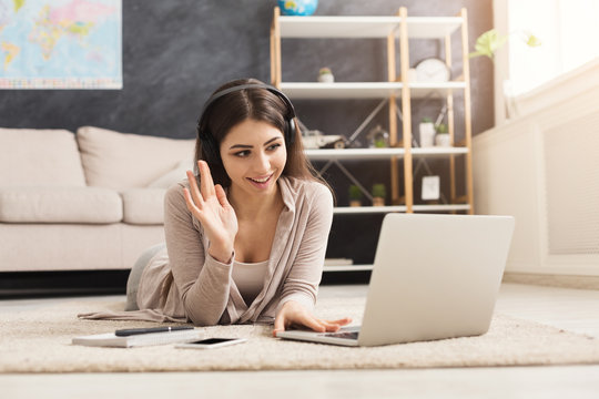 Girl at home communicating on skype in internet