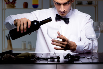 Professional sommelier tasting wine in restaurant
