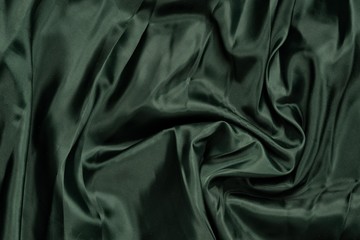 Smooth elegant green silk or satin luxury cloth texture. Retro style.