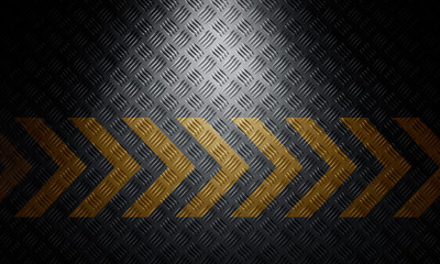 Old black grungy diamond metal plate surface with caution warning chevron tape. Building, construction background. 