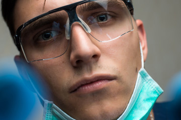 young surgeon on white background