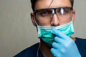 young surgeon on white background