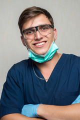 young surgeon on white background