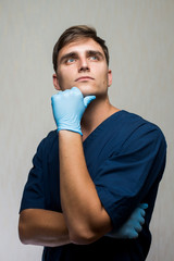young surgeon on white background