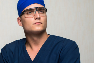 young surgeon on white background
