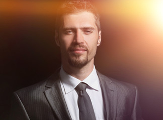 Handsome mature business man isolated on black background