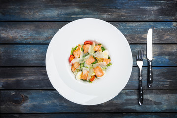 Caesar salad with salmon