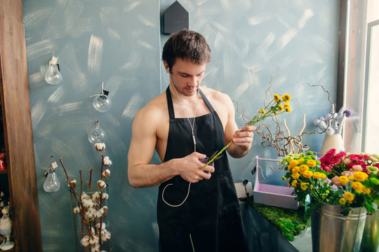 young streaptease performer doing trainerships at flower shop
