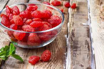 Dried Strawberries on a vintage background
